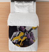 Abstract Geomet Comforter on Bed.